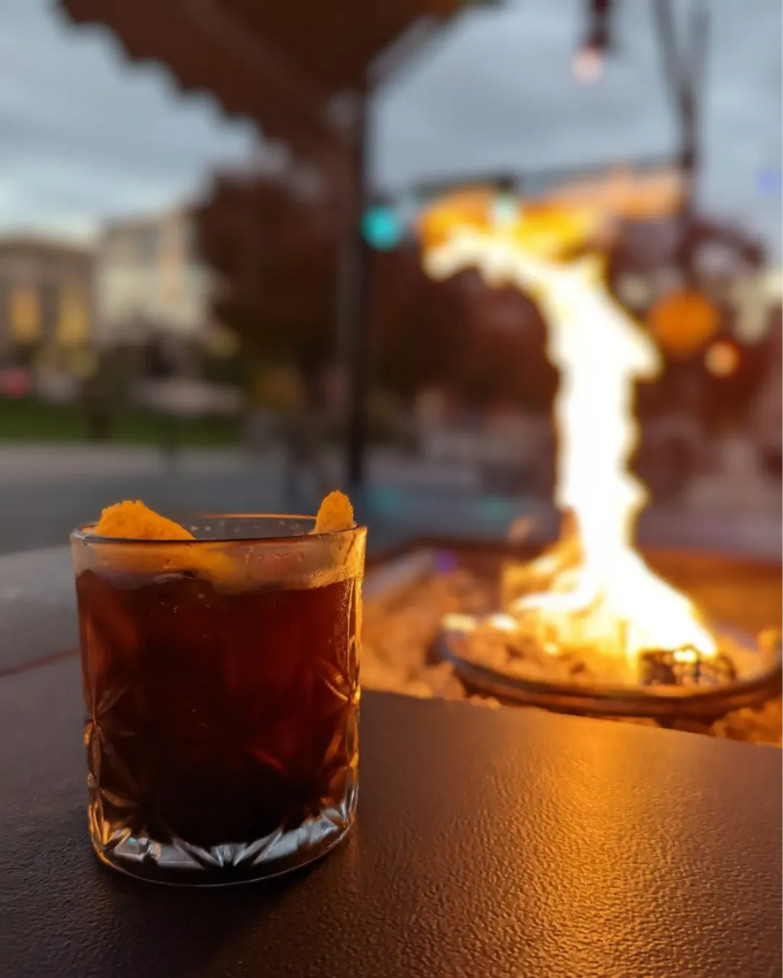 Fire pit cocktail at Fair Witness
